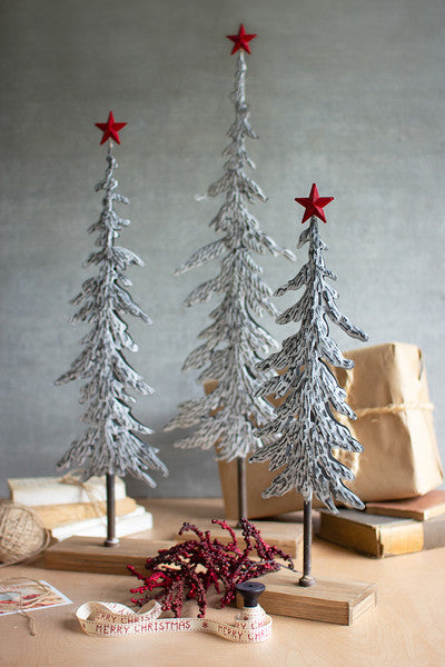 metal christmas trees on wooden bases